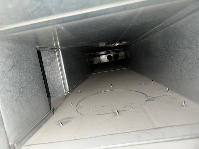 Clean galvanized air duct interior after professional cleaning