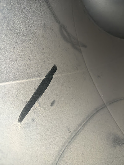 Dirty galvanized air duct interior with dust buildup