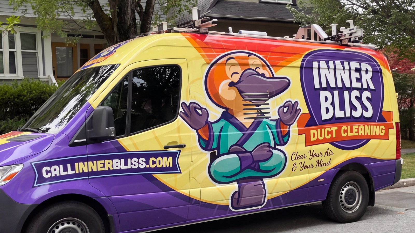 Inner Bliss Duct Cleaning service van parked on a residential street