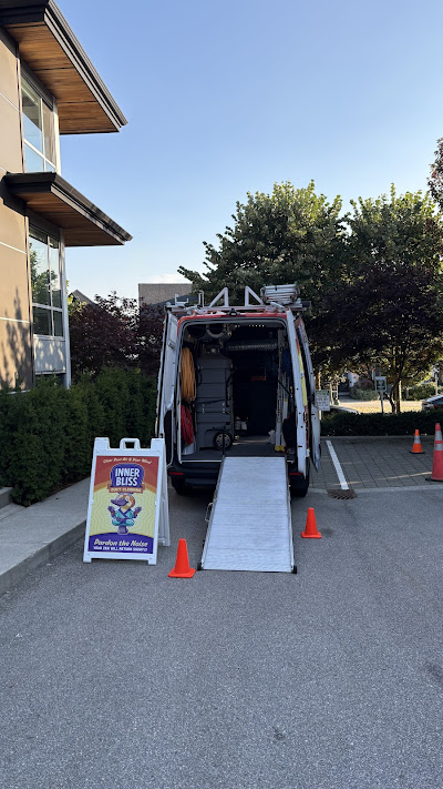 Inner Bliss van with rear ramp, hoses, and professional duct cleaning equipment